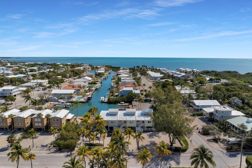 Catch a sunrise over the palms on your balcony and enjoy the - Beach Townhome/Townhouse for sale in Key Largo, Florida on Beachhouse.com