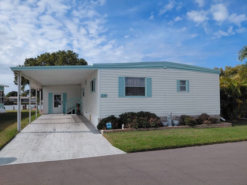 OWN THE LAND. LAKE FRONT HOME is waiting for you in the gated - Beach Home for sale in Holiday, Florida on Beachhouse.com