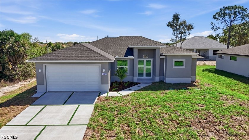 Experience elevated new construction living in Lehigh Acres with - Beach Home for sale in Lehigh Acres, Florida on Beachhouse.com