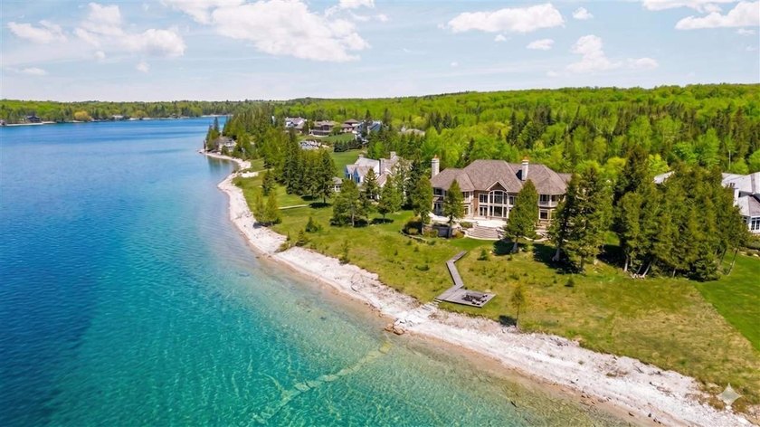 On the famed shores of Oyster Bay, one of Lake Charlevoix's most - Beach Home for sale in Charlevoix, Michigan on Beachhouse.com