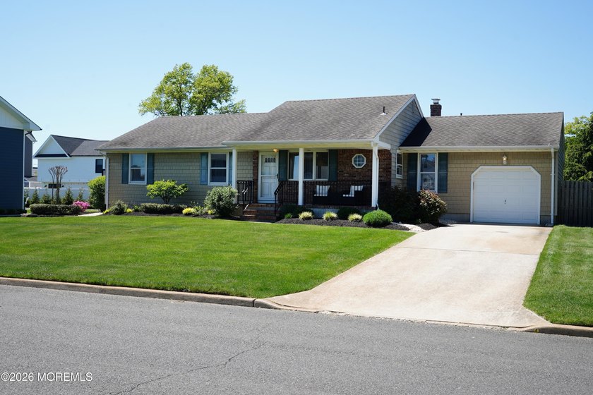 Nestled in the desirable south end of Shark River Hills, this - Beach Home for sale in Neptune, New Jersey on Beachhouse.com