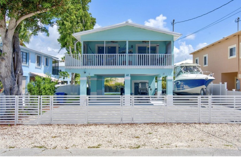 Step inside this beautifully remodeled 3/3 house. Two bedrooms - Beach Home for sale in Key Largo, Florida on Beachhouse.com