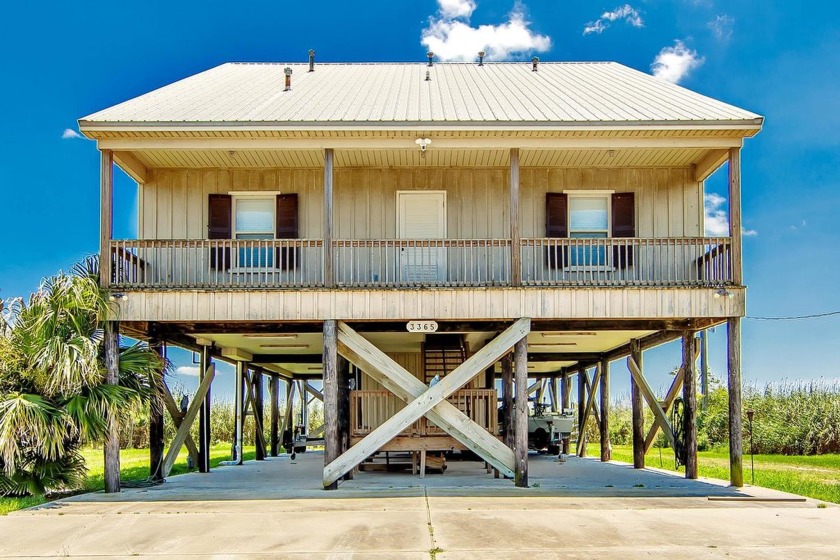 THIS BEAUTIFUL CUSTOM BUILT CAMP OFFERS 4 BEDROOMS AND THREE - Beach Home for sale in Theriot, Louisiana on Beachhouse.com