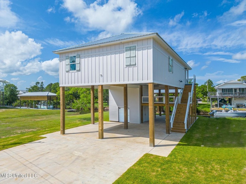Welcome to this stunning 3-bedroom, 2-bath waterfront home - Beach Home for sale in Bay Saint Louis, Mississippi on Beachhouse.com