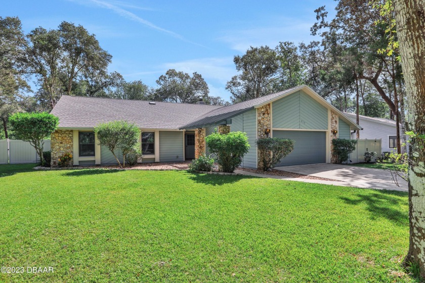 Welcome to Tymber Creek! This remarkable corner lot home is - Beach Home for sale in Ormond Beach, Florida on Beachhouse.com