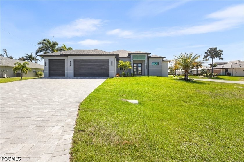 Stunning modern residence featuring an open-concept design and - Beach Home for sale in Cape Coral, Florida on Beachhouse.com