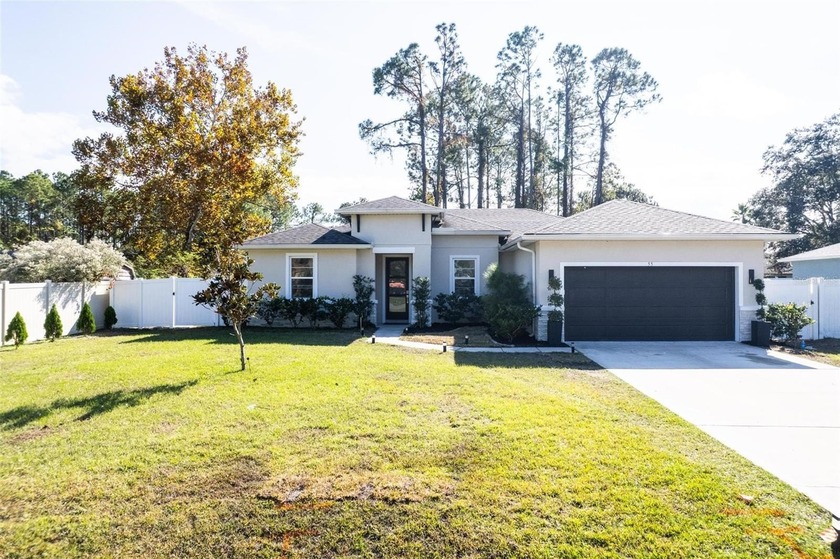 This contemporary Palm Coast home offers a bright, open layout - Beach Home for sale in Palm Coast, Florida on Beachhouse.com