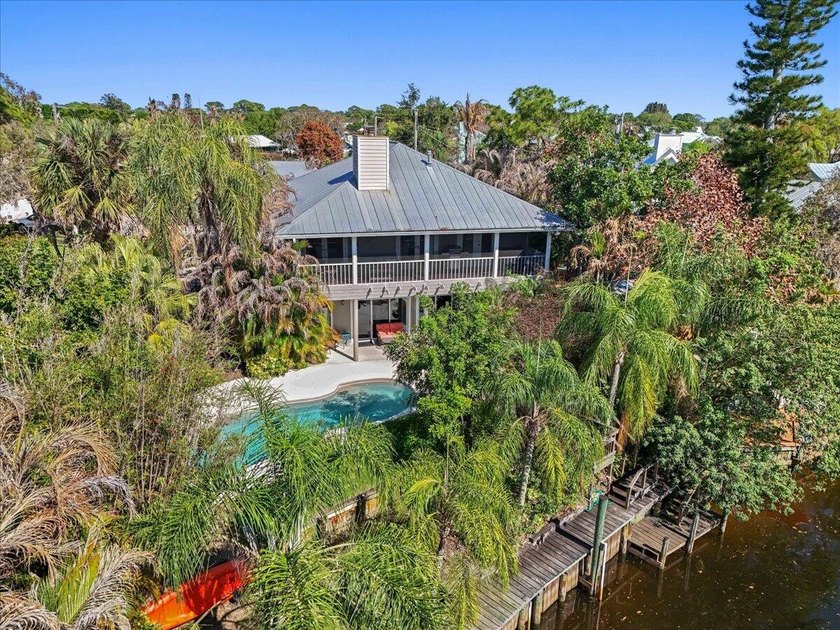 This elevated Key West-style waterfront home captures the - Beach Home for sale in Palm City, Florida on Beachhouse.com