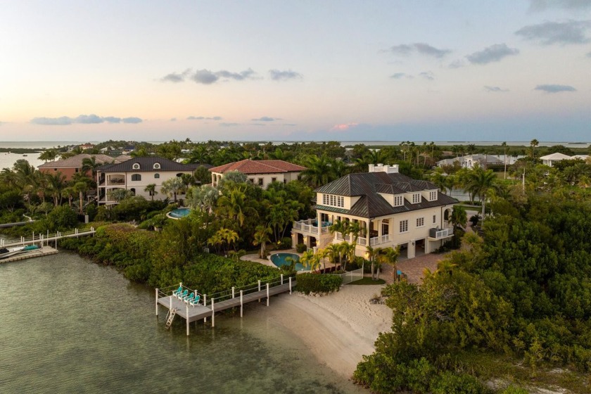 Tucked behind swaying palms and lush tropical landscaping, this - Beach Home for sale in Shark Key, Florida on Beachhouse.com