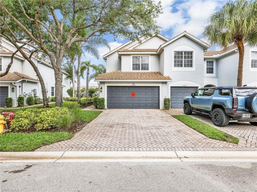 Positioned as a coveted end unit, this 2 car garage, lakefront - Beach Townhome/Townhouse for sale in Naples, Florida on Beachhouse.com