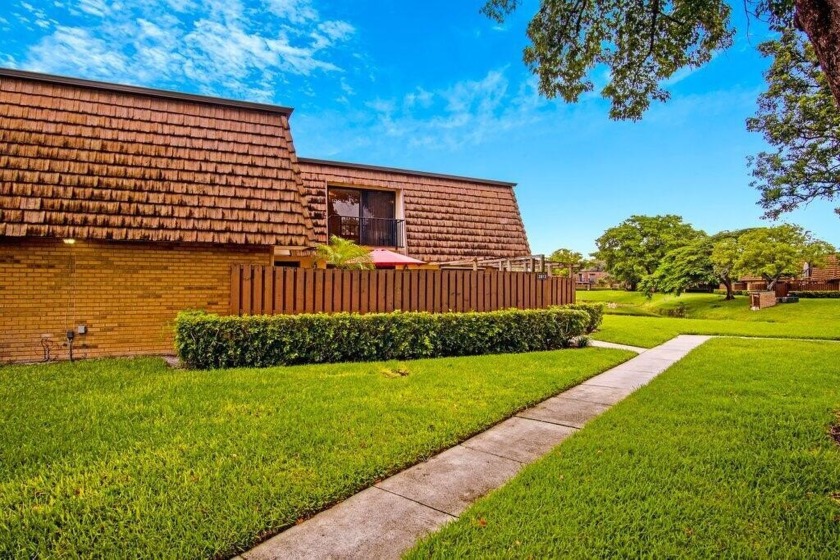 Step into this 2-bedroom townhome with a flex/den on the first - Beach Townhome/Townhouse for sale in Greenacres, Florida on Beachhouse.com