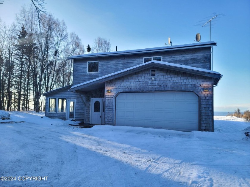 Welcome to your dream retreat, perched along the serene Cook - Beach Home for sale in Kenai, Alaska on Beachhouse.com