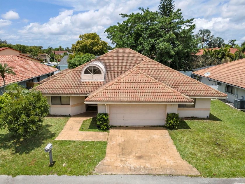 Spacious 3-bedroom, 2-bath pool home situated on an oversized - Beach Home for sale in Lauderhill, Florida on Beachhouse.com