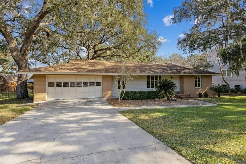Nestled beneath a canopy of mature live oaks on a generous 0 - Beach Home for sale in Fernandina Beach, Florida on Beachhouse.com