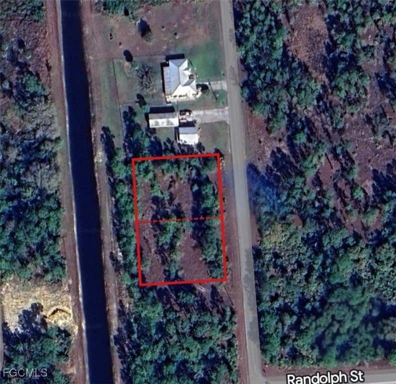 Oversized 1/2-acre lot with canal frontage located in a quiet - Beach Lot for sale in Lehigh Acres, Florida on Beachhouse.com