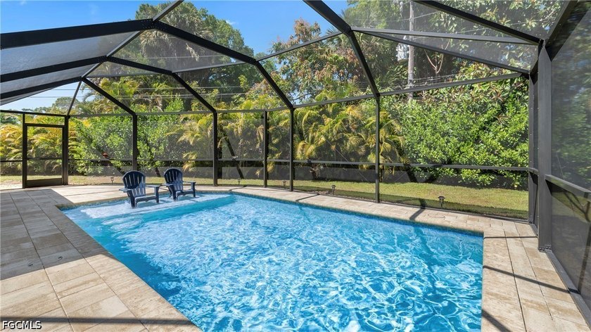 Discover this beautifully updated pool home in Waterway Estates - Beach Home for sale in North Fort Myers, Florida on Beachhouse.com