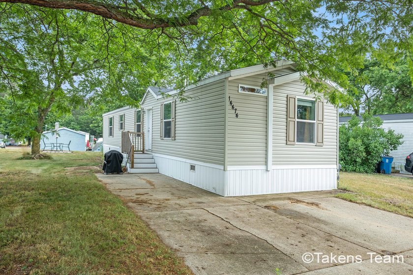This newer 2021 Pulse Collection manufactured home is located in - Beach Home for sale in West Olive, Michigan on Beachhouse.com