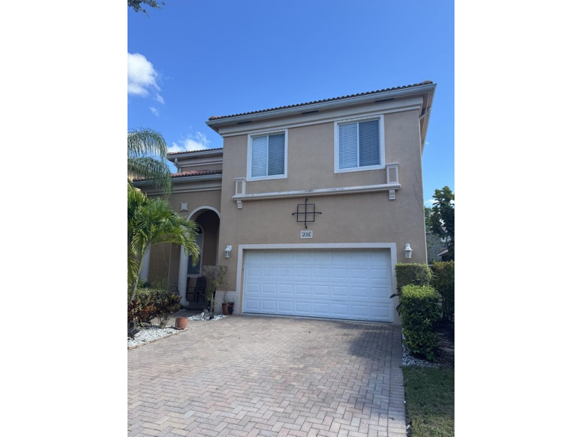 This stunning 2 story home in the sought-after gated community - Beach Home for sale in West Palm Beach, Florida on Beachhouse.com