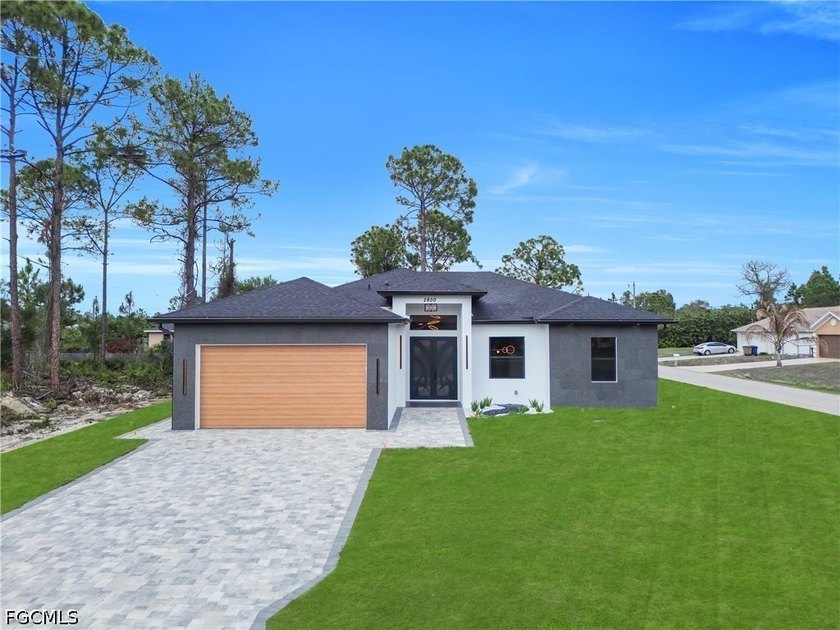Situated on a desirable CORNER LOT, this beautiful new - Beach Home for sale in Lehigh Acres, Florida on Beachhouse.com
