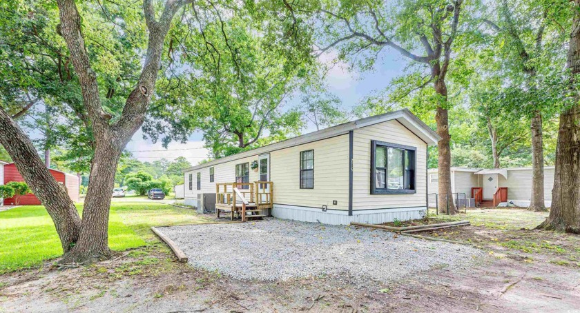 Welcome 582 Mimosa Drive in the Waterford Oaks community. Just a - Beach Home for sale in Garden City Beach, South Carolina on Beachhouse.com