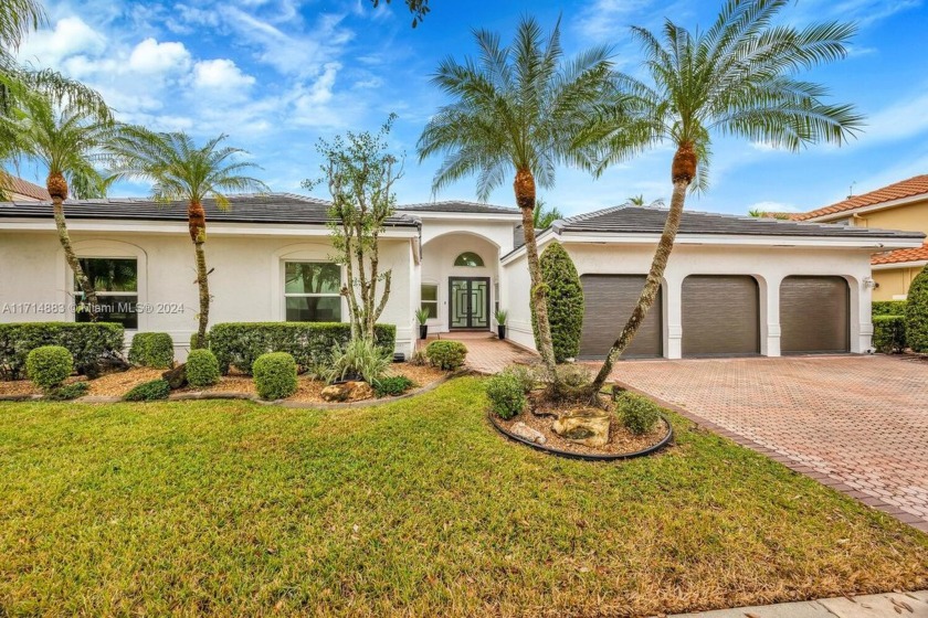 Exquisite lakefront home in the exclusive, gated Sunset Isles - Beach Home for sale in Pembroke Pines, Florida on Beachhouse.com