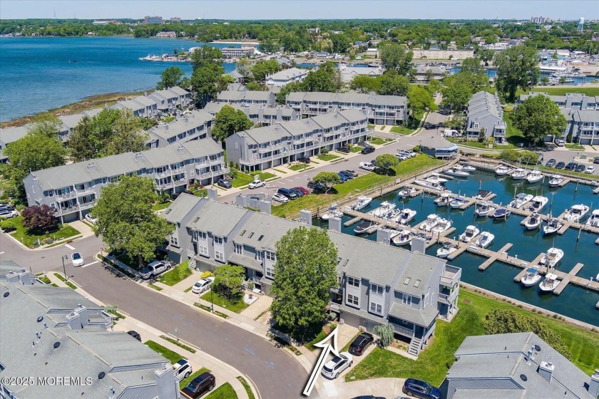 Embrace the tranquility of waterfront living in this 3-level - Beach Condo for sale in Neptune, New Jersey on Beachhouse.com