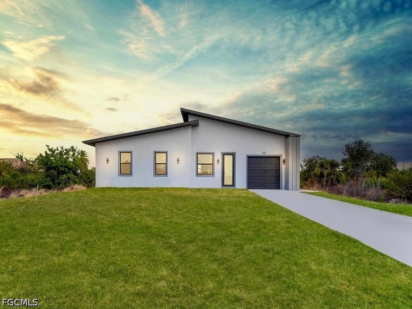 Welcome to this MAGNIFICENT MODERN 3/3 Nestled away on a quiet - Beach Home for sale in Lehigh Acres, Florida on Beachhouse.com