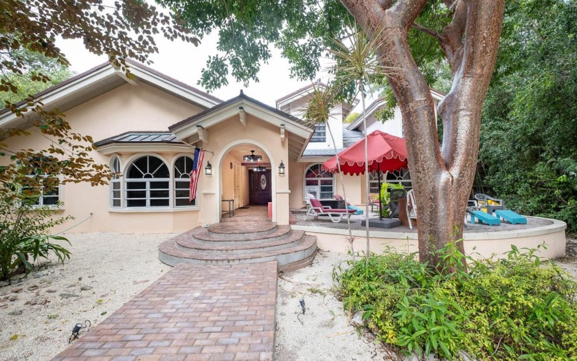 Nestled into a lush hardwood hammock, this property is gated for - Beach Home for sale in Key Largo, Florida on Beachhouse.com
