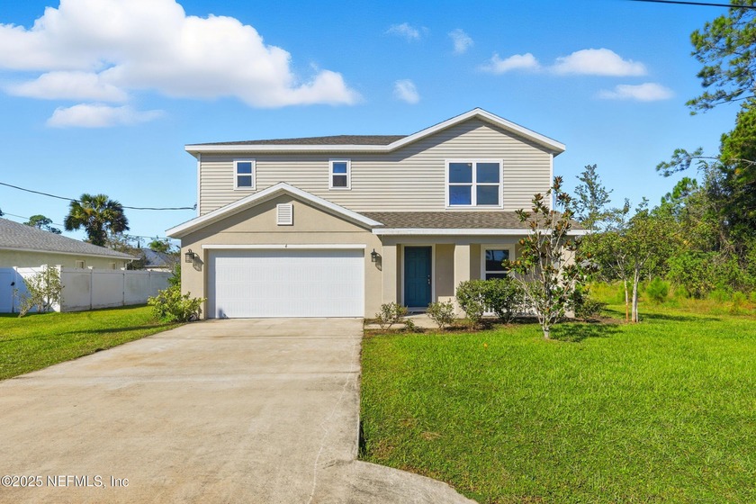 Welcome to 4 Round Tree Drive, a beautifully refreshed two-story - Beach Home for sale in Palm Coast, Florida on Beachhouse.com