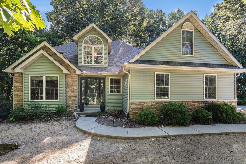 Welcome to this beautiful 4-bedroom, 2.5-bathroom home nestled - Beach Home for sale in Stevensville, Michigan on Beachhouse.com