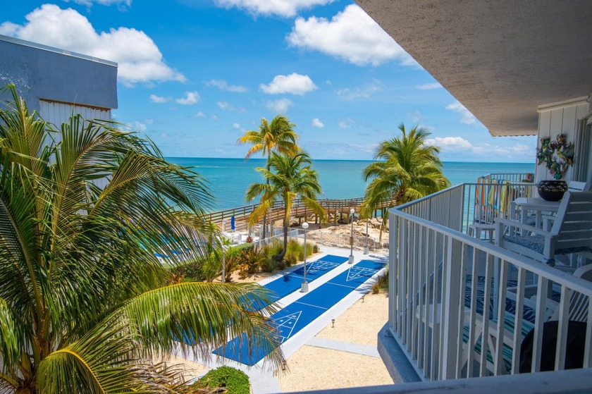 Start your day with a coffee while watching the sunrise over the - Beach Condo for sale in Key Colony Beach, Florida on Beachhouse.com