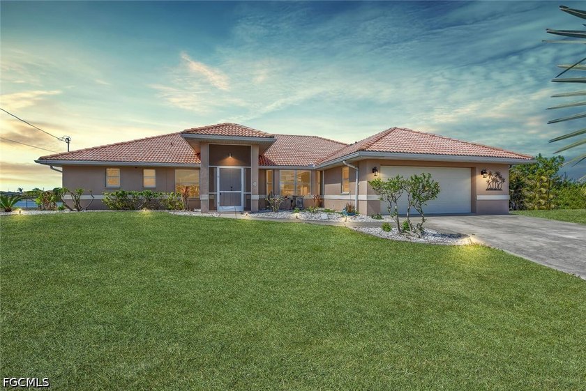 Waterfront Living at Its Finest! This stunning tile roof home - Beach Home for sale in Cape Coral, Florida on Beachhouse.com