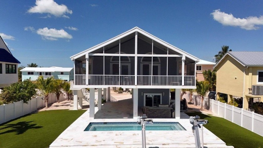 Beautifully renovated waterfront pool home in Key Largo offering - Beach Home for sale in Key Largo, Florida on Beachhouse.com