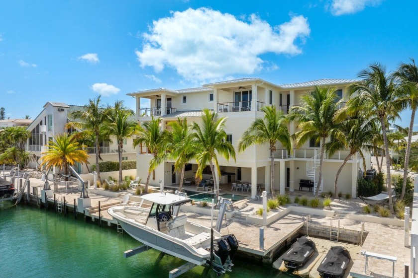 Experience the pinnacle of luxury waterfront living in this - Beach Home for sale in Plantation Key, Florida on Beachhouse.com