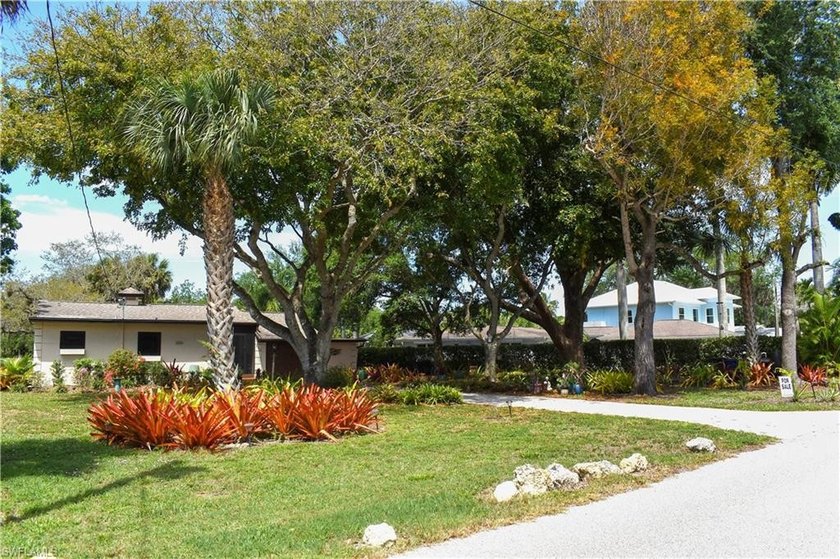Charming river cottage-style home nestled in a lush, beautifully - Beach Home for sale in Bonita Springs, Florida on Beachhouse.com