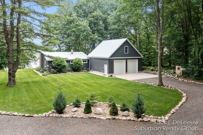 Welcome to this one of a kind lakefront retreat nestled along - Beach Home for sale in New Era, Michigan on Beachhouse.com