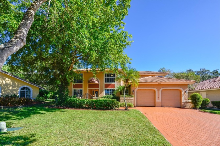 This beautifully updated 5-bedroom, 3.5-bath home sits on a 0 - Beach Home for sale in Coral Springs, Florida on Beachhouse.com