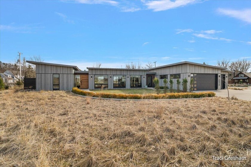 Tucked along the edge of the KLH Dunes Preserve, this - Beach Home for sale in Spring Lake, Michigan on Beachhouse.com
