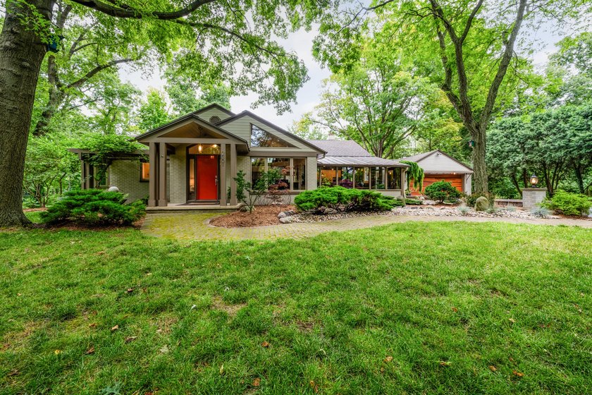 Tucked behind a canopy of mature trees, this stunning - Beach Home for sale in Saint Joseph, Michigan on Beachhouse.com