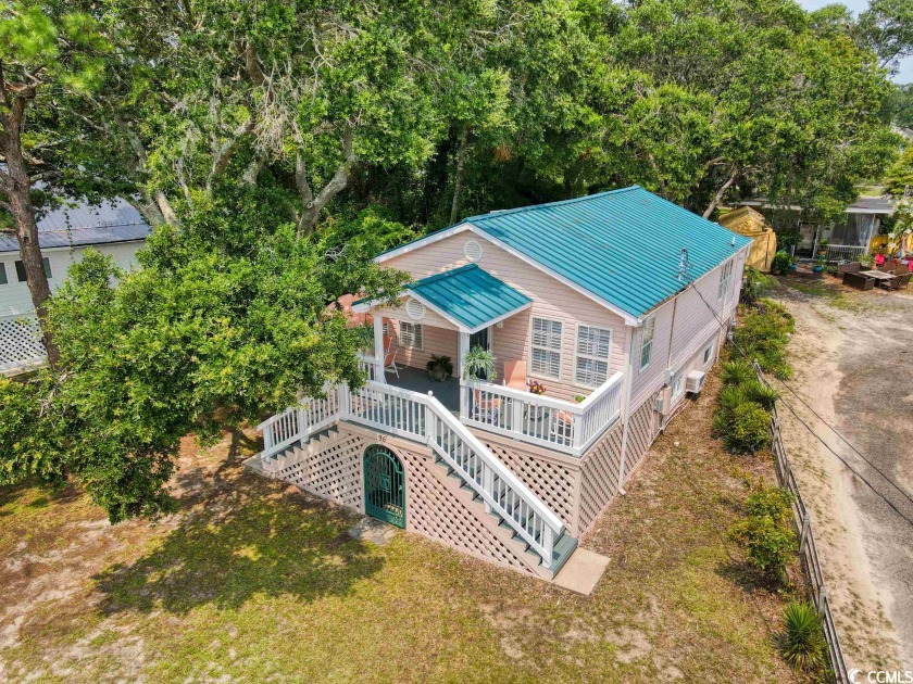 Live in a bit of history!  This lovely beach cottage is one of - Beach Home for sale in North Myrtle Beach, South Carolina on Beachhouse.com