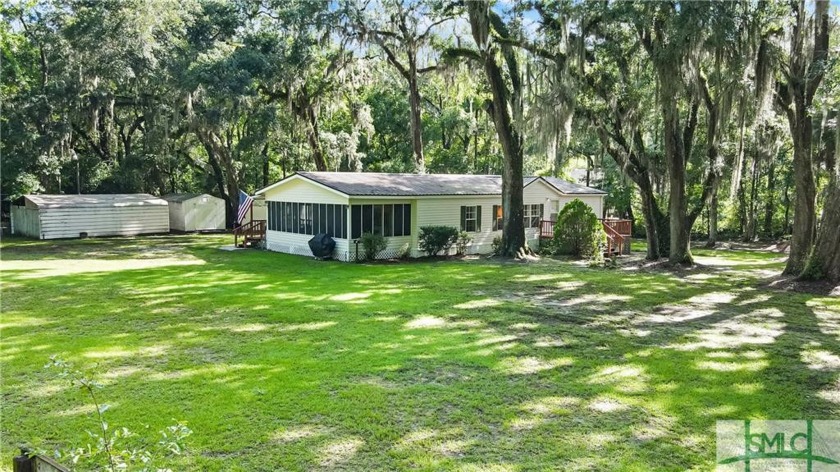 Tucked at the end of a quiet dirt road and just a few minutes - Beach Home for sale in Darien, Georgia on Beachhouse.com