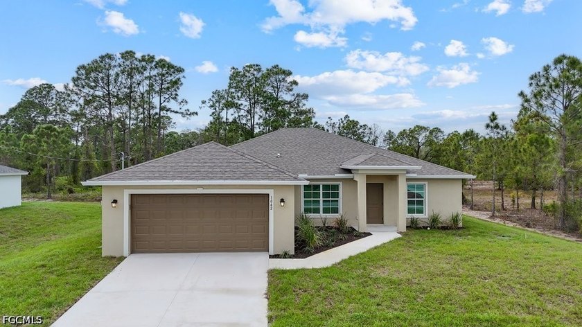 Welcome to this beautifully designed new construction home - Beach Home for sale in Lehigh Acres, Florida on Beachhouse.com