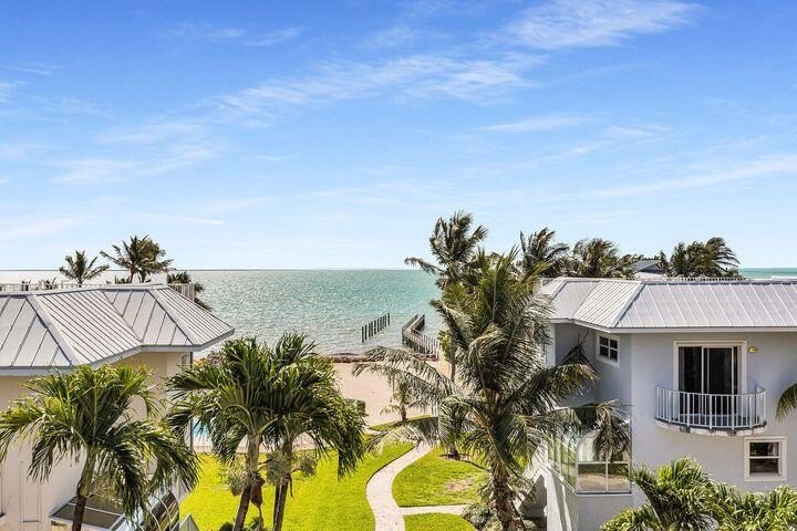 Welcome to Port of Call, an exclusive low-density, private - Beach Townhome/Townhouse for sale in Plantation Key, Florida on Beachhouse.com