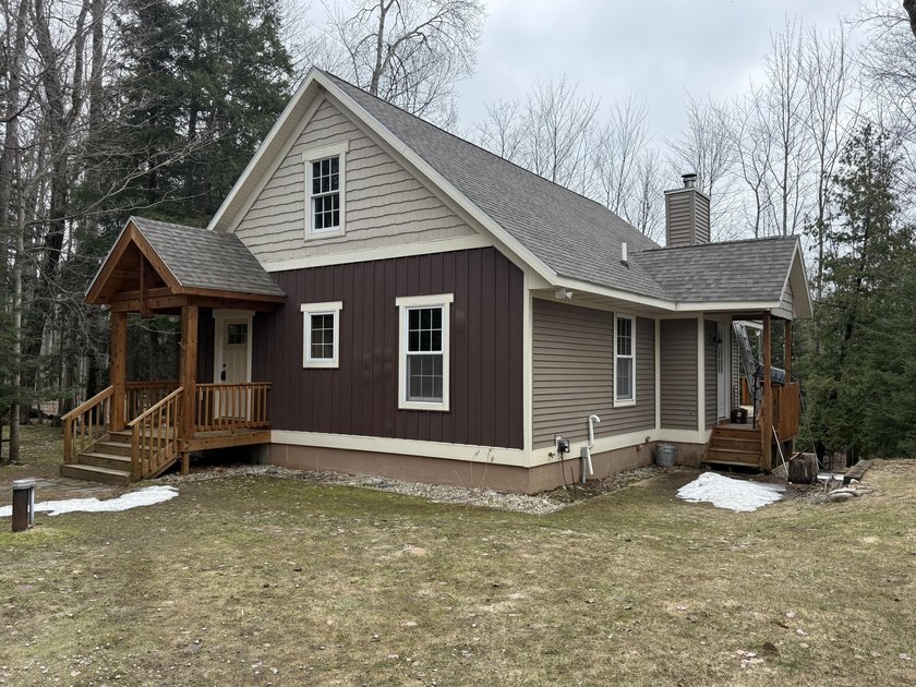 This charming country property offers a stunning custom-built - Beach Home for sale in Charlevoix, Michigan on Beachhouse.com
