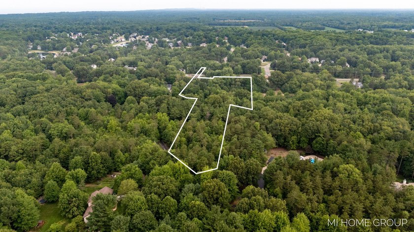 Imagine living on this beautiful wooded and private 4.3 acre - Beach Acreage for sale in Holland, Michigan on Beachhouse.com