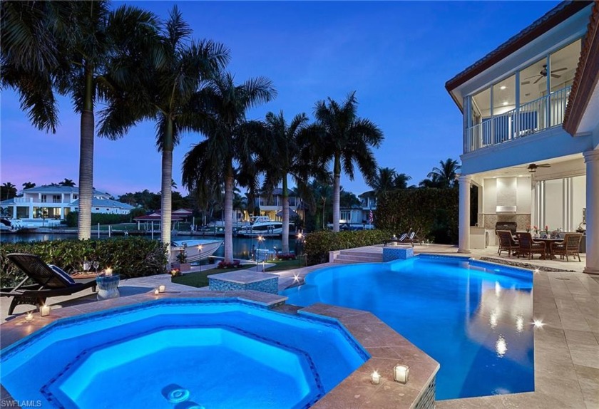 Situated on the serene waters of Compass Cove, this refreshed - Beach Home for sale in Naples, Florida on Beachhouse.com