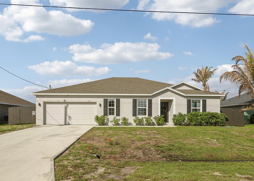 Built in 2021 and situated on an oversized fenced waterfront lot - Beach Home for sale in Port Saint Lucie, Florida on Beachhouse.com