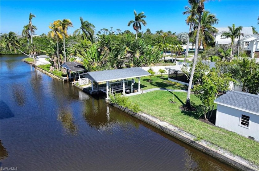 Situated within Brookside, this expansive waterfront property - Beach Home for sale in Naples, Florida on Beachhouse.com