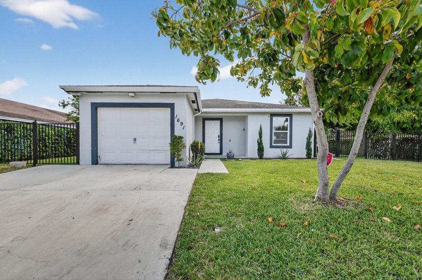 Completely upgraded home, which truly offers Florida living at - Beach Home for sale in Riviera Beach, Florida on Beachhouse.com