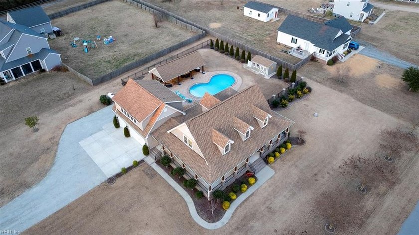 Immaculate 4-bedroom, 2.5-bath home featuring a first-floor - Beach Home for sale in Knotts Island, North Carolina on Beachhouse.com